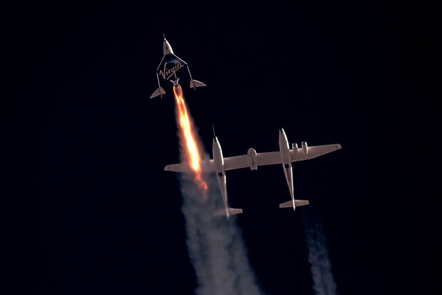 A rocket-powered spaceplane blasts off for the edge of space after being released from a carrier plane.