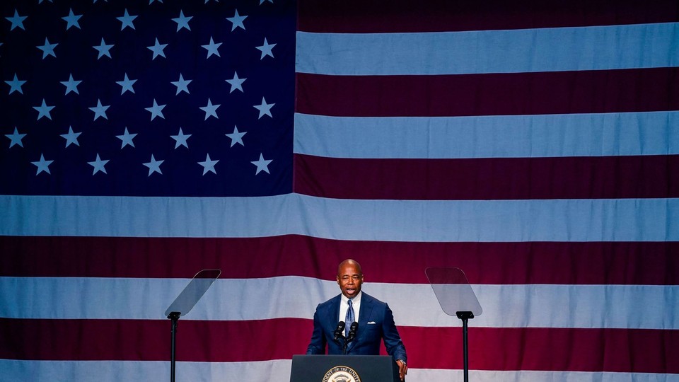 New York City mayor Eric Adams in front of the American flag