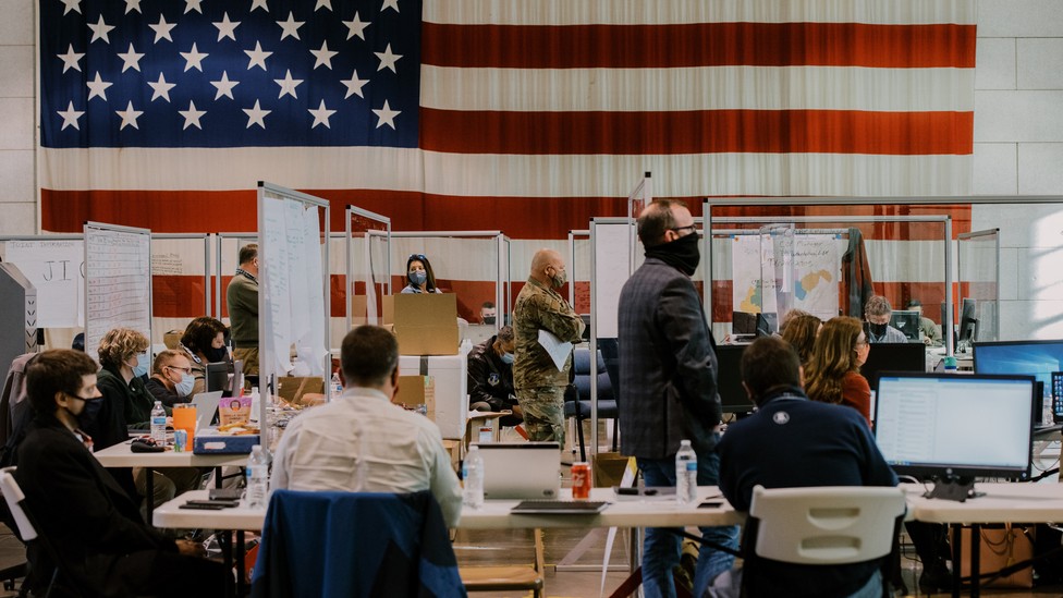 Members of a coronavirus vaccine task force met in a command center in Charleston, West Virginia.