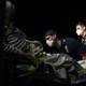 Paramedics prepare to transport a coronavirus patient to the hospital.
