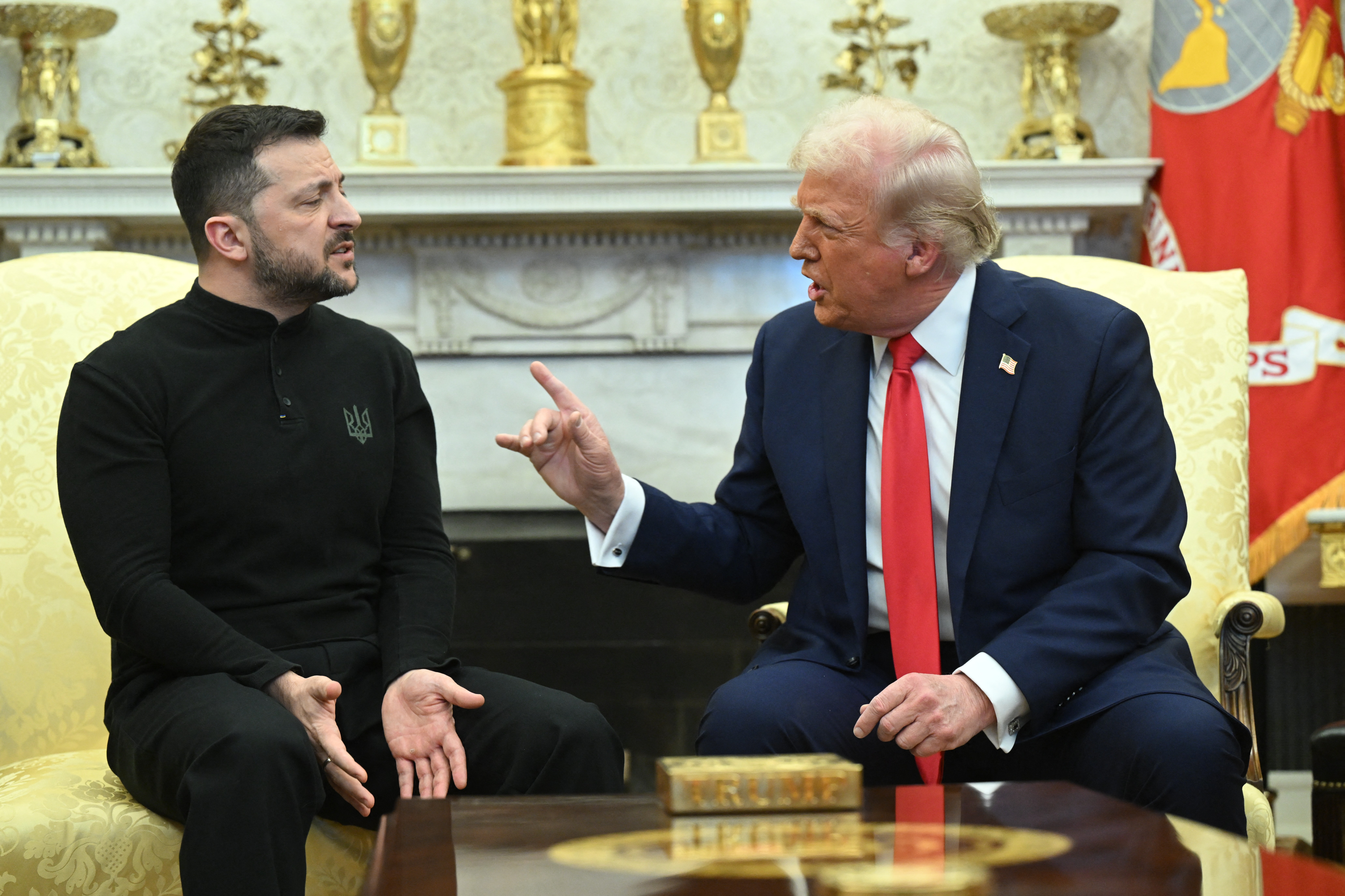 President Donald Trump points a finger while speaking to Ukraine’s President Volodymyr Zelensky during a meeting in the Oval Office of the White House.