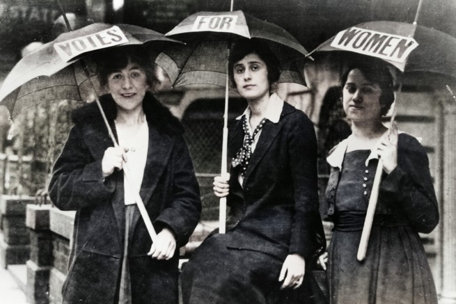 Three women protesting for the right to vote at the Democratic National Convention