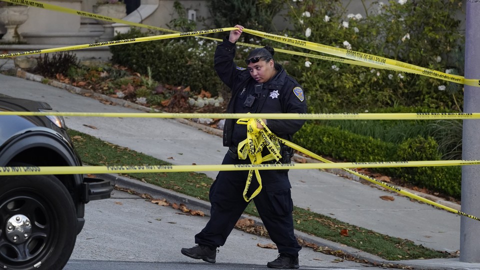 A San Francisco police officer and yellow tape