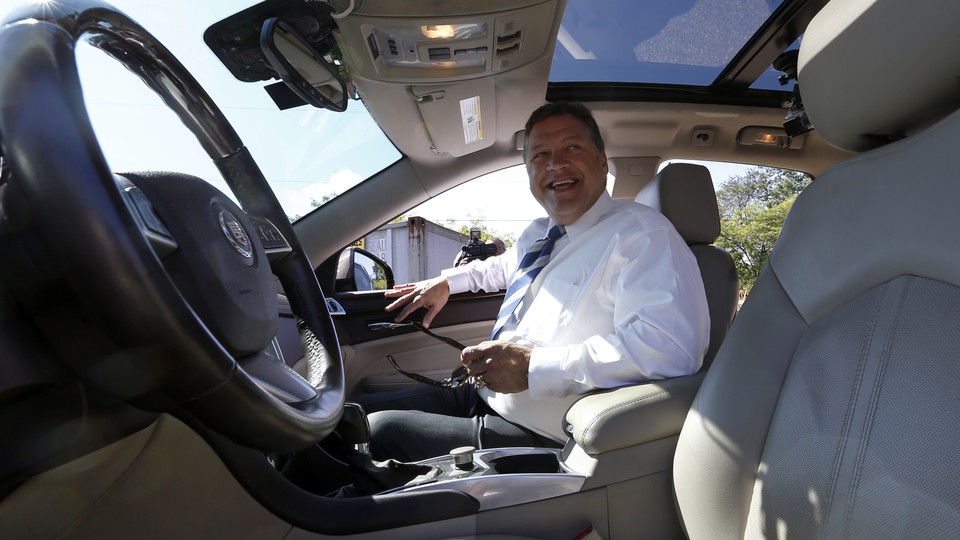 U.S. Rep. Bill Shuster, the chairman of the House Transportation and Infrastructure Committee, smiles as he steps into the passenger seat of a a self-driving car in Pennsylvania, in 2013.