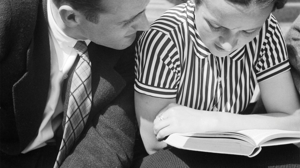 a man and woman reading