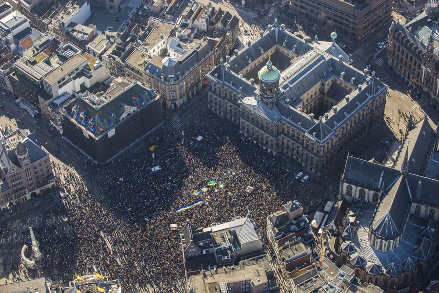 An aerial view of a town square filled with protesters.