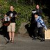 Yee Feng sings "Keep Your Head Up" by Andy Grammer with wife, Carolyn, and kids Ellie, 9, and Jediah, 11, during a neighborhood sing-along they have started doing each evening to connect with neighbors while social distancing during the coronavirus outbreak in Seattle.