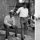 left: photo of two men wearing sunglasses and hats; right: photo of woman wearing denim