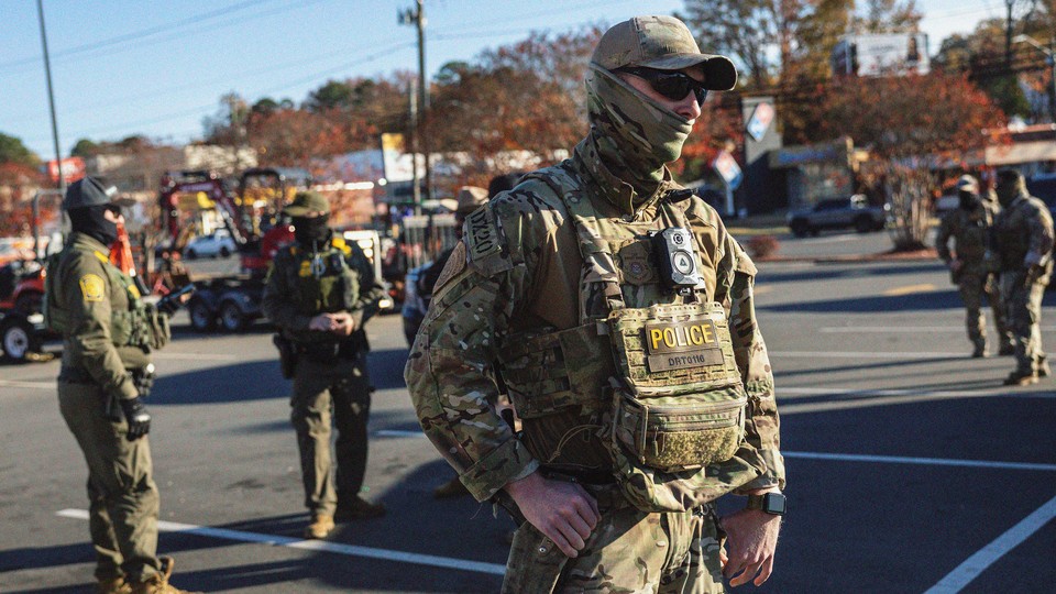 U.S. Border Patrol agents stand outside a Home Depot store on November 19, 2025 in Charlotte, North Carolina. Federal agents continued searching for undocumented immigrants during Operation Charlotte's Web as they expanded their operations to other parts of North Carolina.