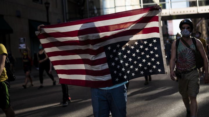 Protesters march through the street on May 28, 2020 in downtown Minneapolis, Minnesota.