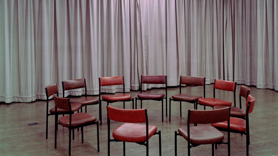 A photo of a circle of empty chairs