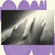 A black-and-white photograph is set on a cream-colored background. The background has a row of purple circles at the top that look like they are curving away and a row of purple circles at the bottom that look like they are curving in the other direction. The black-and-white photo shows a set of hands reaching through fog towards the light.