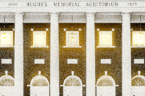 Illustration of the Hughes Memorial Auditorium—a light glimmers in an upstairs window between columns
