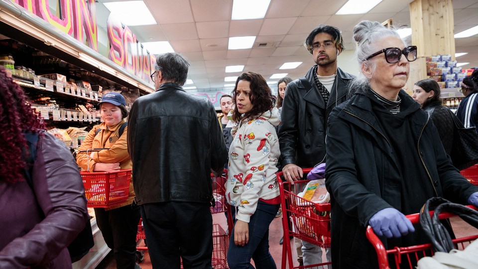 Grocery shoppers in a Trader Joe's