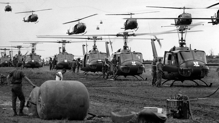 U.S. Huey helicopters fly in formation over a landing zone in South Vietnam during the Vietnam War, date unknown.