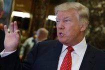 President-elect Donald Trump talks with reporters in Trump Tower in New York.