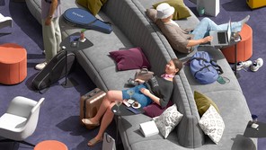 detail from illustration of travelers relaxing on large gray sofa in purple-carpeted lounge