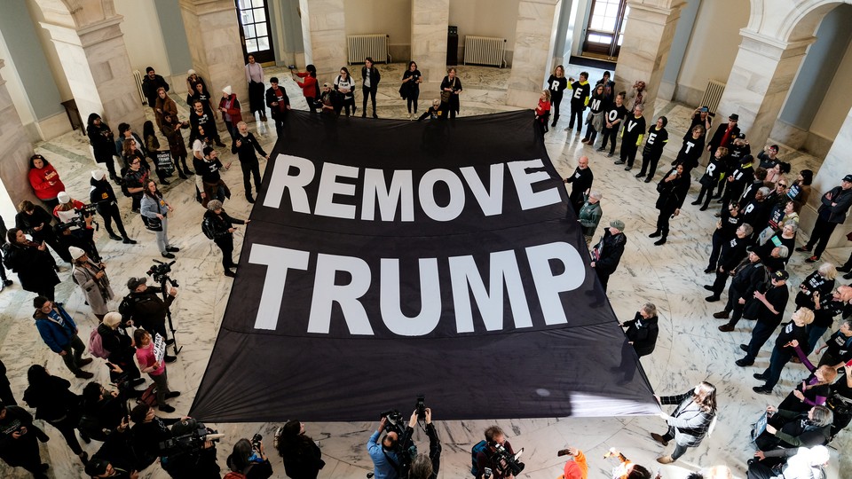 Protesters call for President Trump to be removed from office.