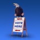 An eagle sitting on a "Vote Here" sign