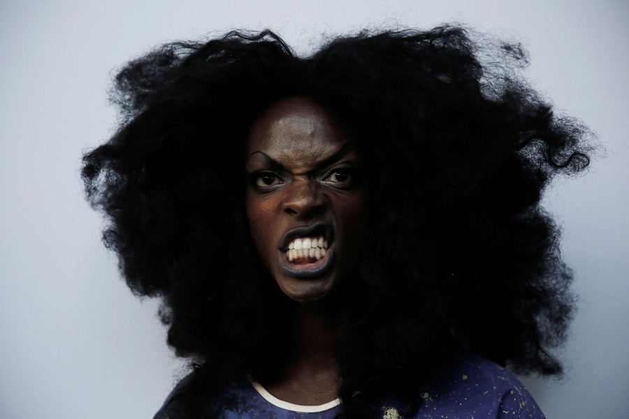 A visitor poses for a picture during Sao Paulo Fashion Week in Sao Paulo, Brazil, on March 16, 2017.