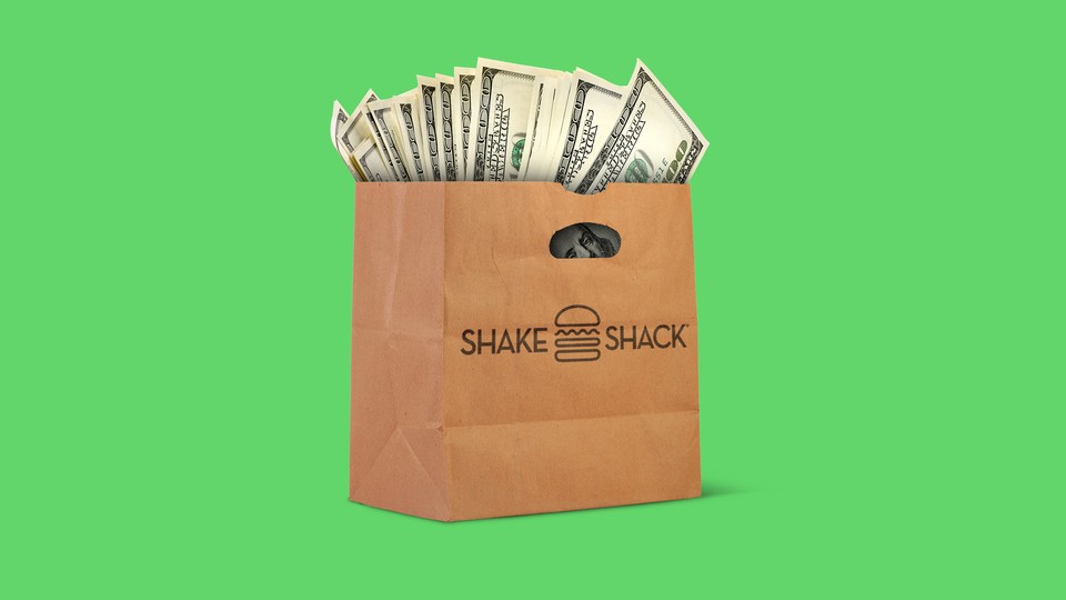 An illustration of a Shake Shack bag with money.