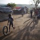 A boy plays at a refugee camp for Haitians returning from the Dominican Republic on the outskirts of Anse-a-Pitres, Haiti, September 7, 2015.