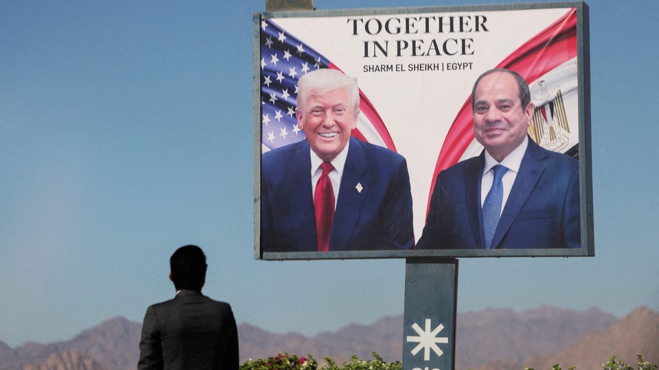 A color photograph of a poster showing Donald Trump next to Egyptian President Abdel Fattah el-Sisi, with "Together In Peace" written above them.