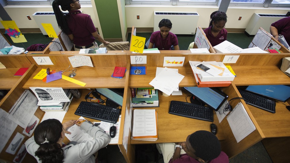 An overhead shot of students working on computers