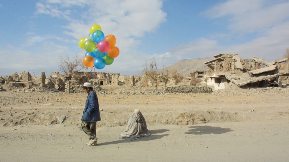 Boy selling balloons in Kabul in the early 1990's.