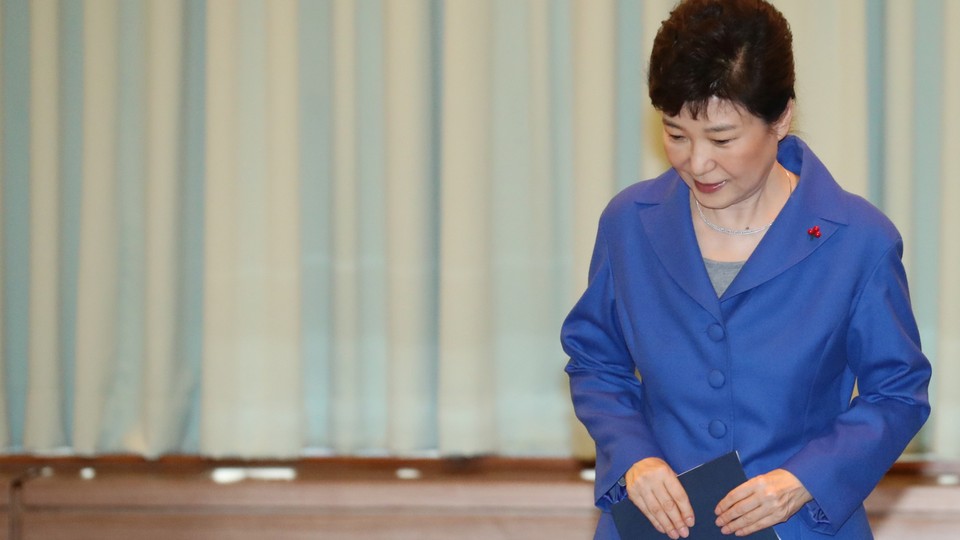 Park Geun-Hye arrives at an emergency cabinet meeting on December 9.