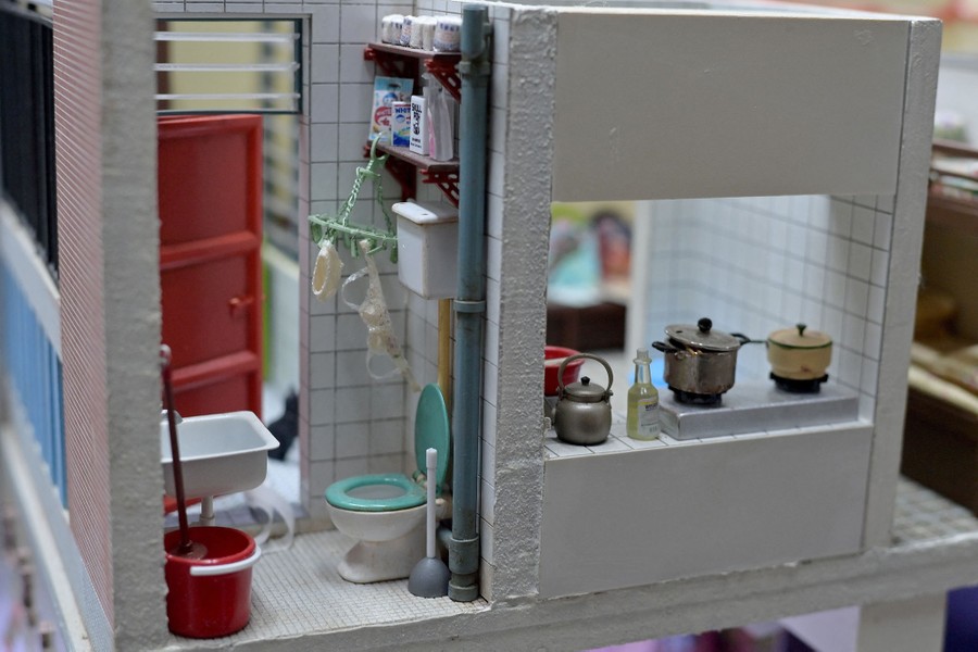 A miniature scene of part of a small Hong Kong apartment