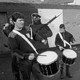 A black and white photo of boys playing drums in Belfast in 1991