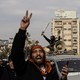 National Syrian Army soldiers celebrate in Hama, Syria, throwing up a peace sign