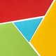 Interconnecting shapes in red, cyan, green, and yellowâ€”Google's colors