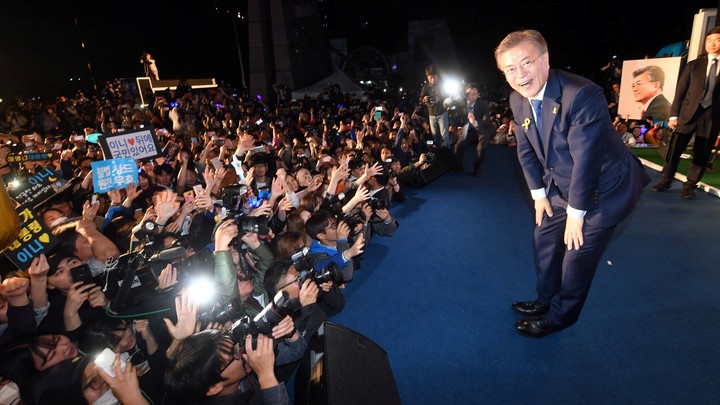 South Korea's president Moon Jae-in bows to his supporters at Gwanghwamun Square in Seoul.