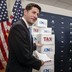 House Speaker Paul Ryan pointing to boxes of petitions supporting a tax-reform bill