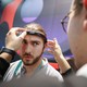A person is outfitted with a headband for detecting brain activity at the Consumer Electronics Show 2020.