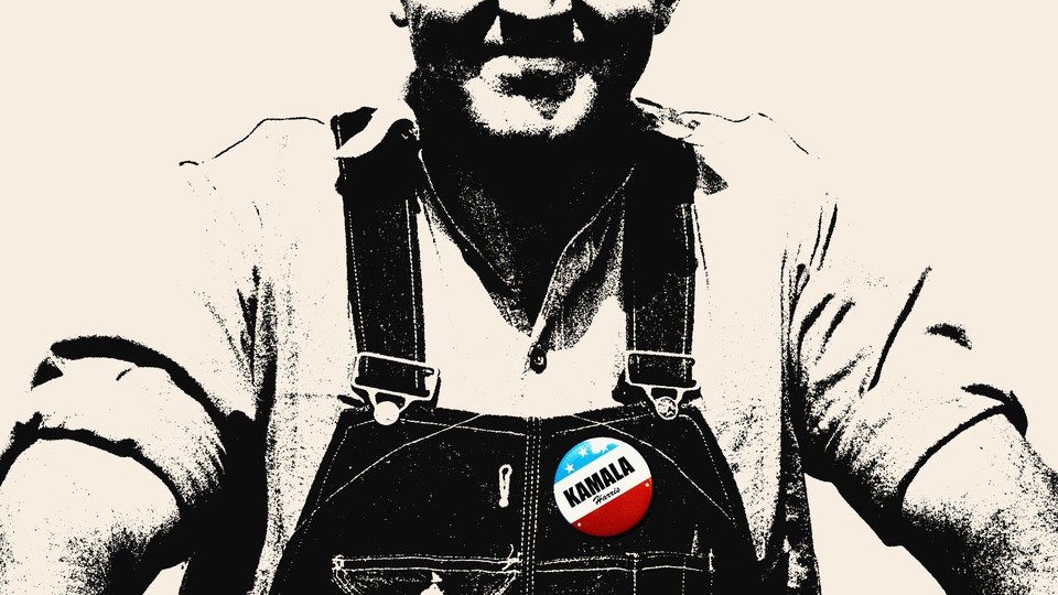 A white man wearing a Kamala Harris sticker on his overalls
