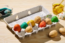 egg carton with dyed potatoes