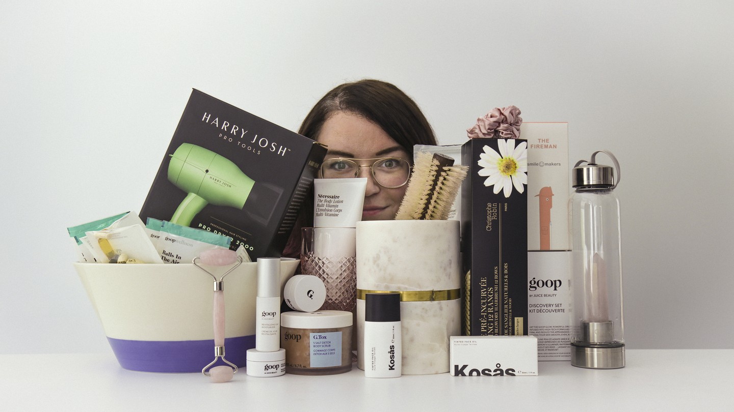 The writer's face, partially obscured by $1,279 of Goop products.