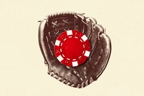 A baseball glove holding a poker chip