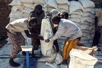 People holding a food- aid bag
