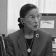 A photograph of Ruth Bader Ginsburg seated at a desk