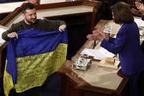 President Volodymyr Zelensky with a Ukrainian flag in the U.S. Congress