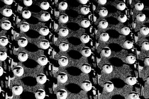 Black-and-white photo showing a mass-produced batch of wide-open eyeballs