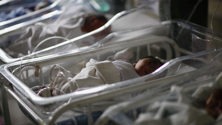 Newborn babies sleep in cribs inside a hospital in the Philippines, in 2013, five days after Typhoon Haiyan devastated the area.