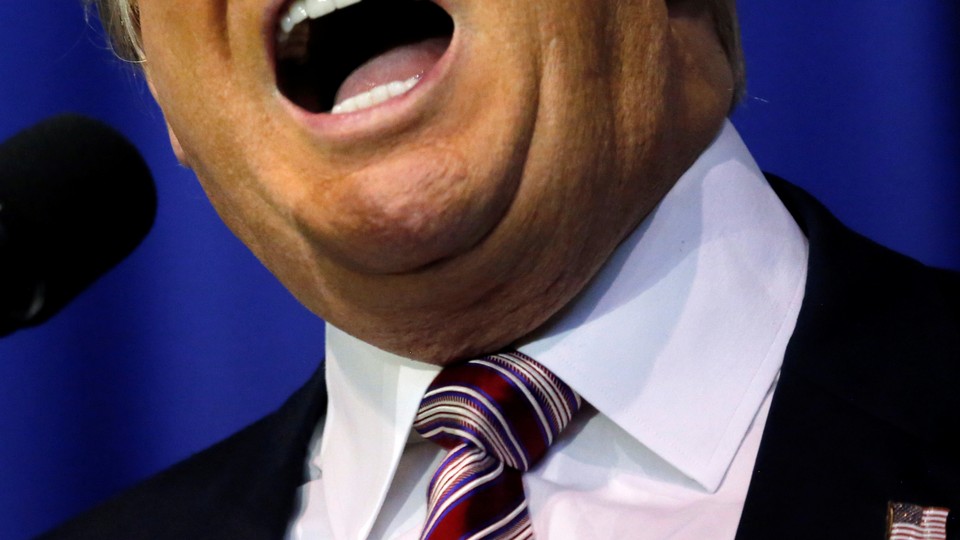 A close-up of Donald Trump speaking into a microphone