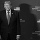 A black-and-white photo of Donald Trump and Pete Hegseth standing next to each other