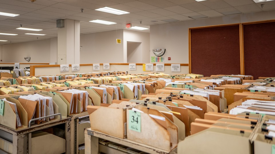 Carts containing documents sit organized at the IRS Processing Facility in Texas