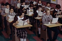 A group of students sits in a parochial-school classroom